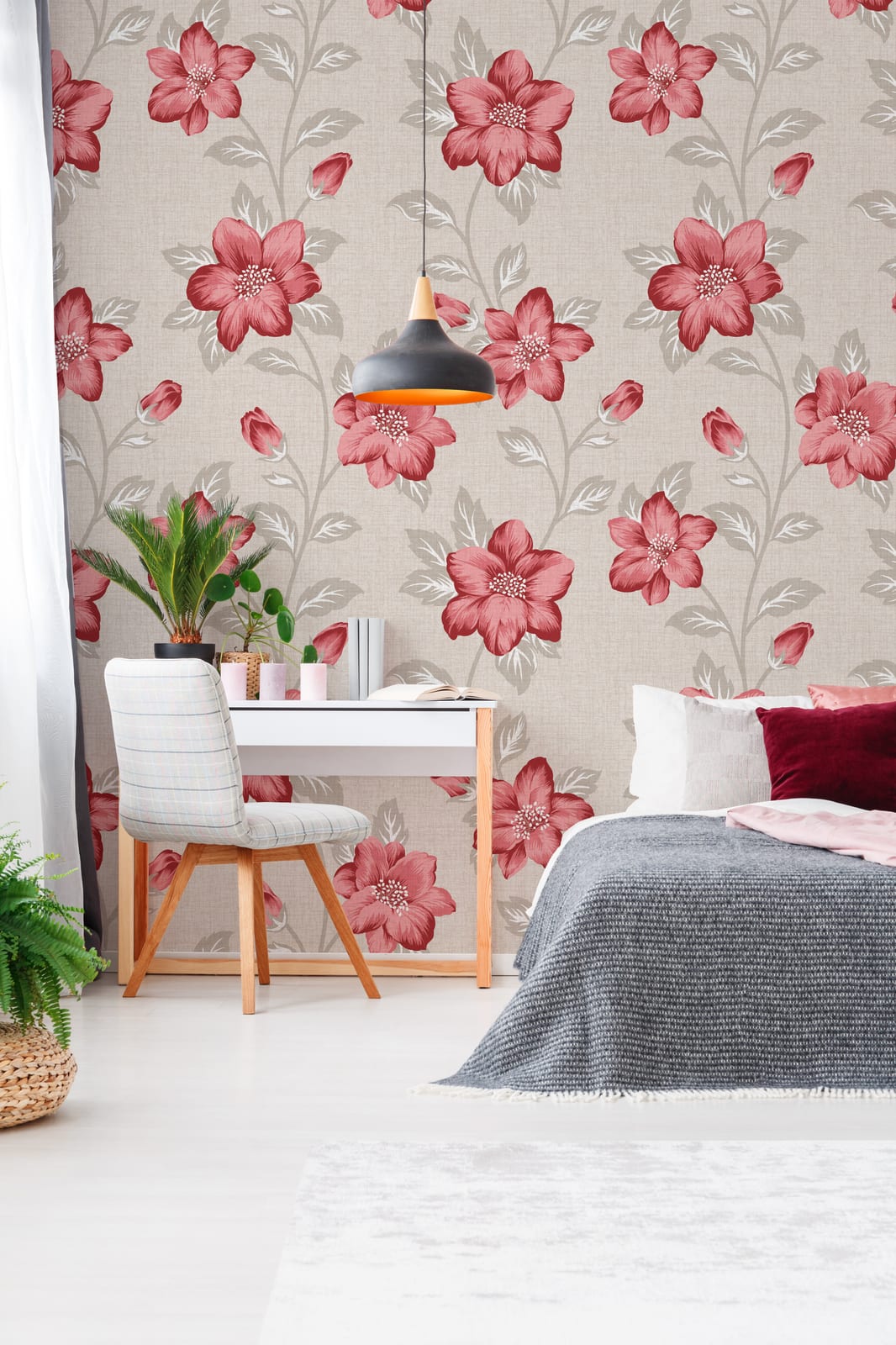 Sitting area enhanced using floral wallpaper with bold red blossoms and soft neutral tones